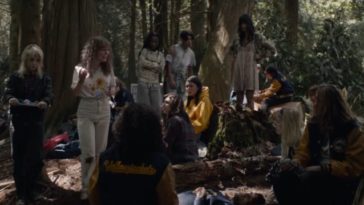 The Yellowjackets team stands in the woods after the plane crash