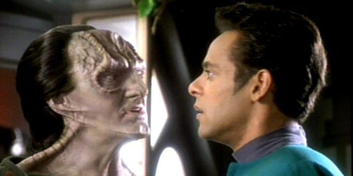 Garak glowers up in Dr Bashir's face, who looks a little taken aback.