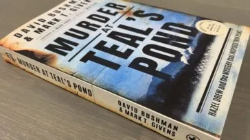 The cover displays the words "Murder at Teal's Pond" in large black text over a mostly blue image for a pond in front of trees, smoke and a mountain.