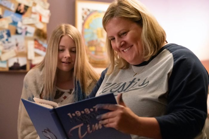 Sam looks at a 1987 yearbook with her niece Shannon