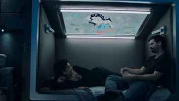 Naomi reclines on her bed as James sits next to her on the Rocinante