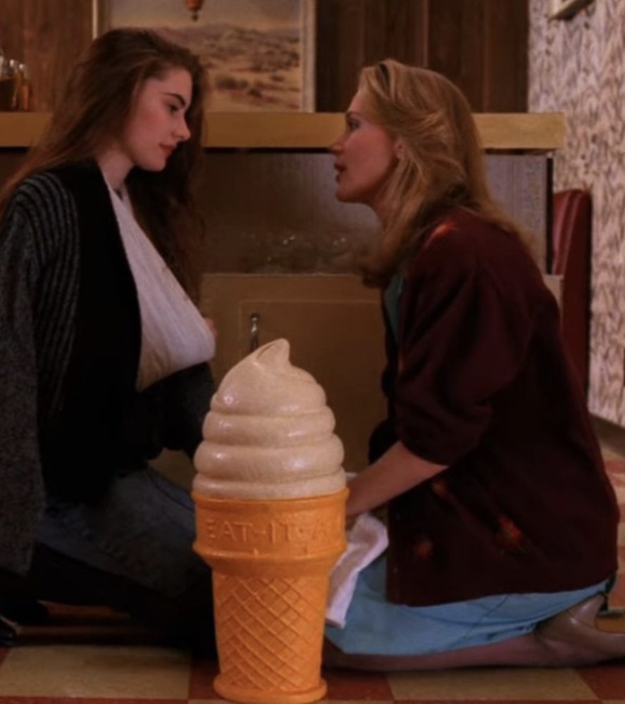 norma and shelly sit by the ice cream cone at the diner