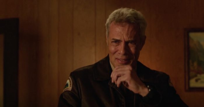 Dana Ashbrook as Bobby Briggs from Twin Peaks: The Return. He is holding a hand up to his face and is on the verge of tears
