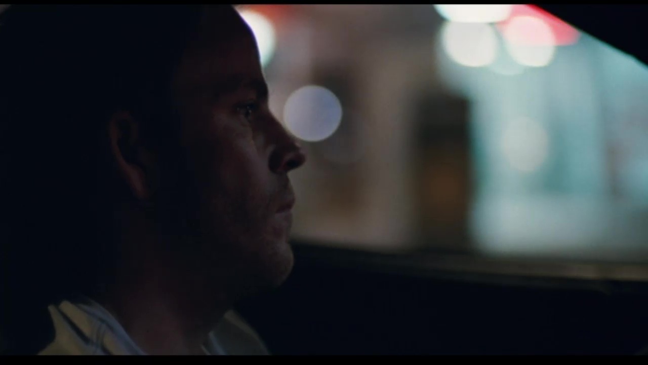 Image from Somewhere: Johnny driving his car at night.