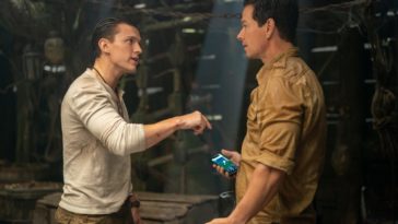 Tom Holland and Mark Wahlberg argue a phone and a route in Uncharted