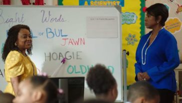 A teacher points at the word Hoagie on a board in Abbott Elementary