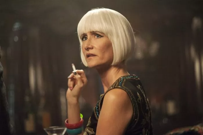 Laura Dern as Diane, holding a cigarette