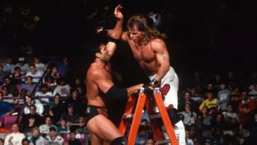 Razor Ramon and Shawn Michaels slug it out at the top of the ladder at WrestleMania X
