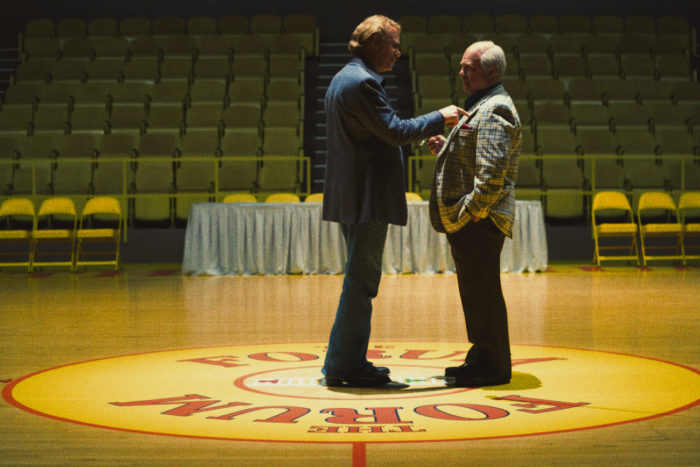 Jerry Buss and Red confront each other on the court. 