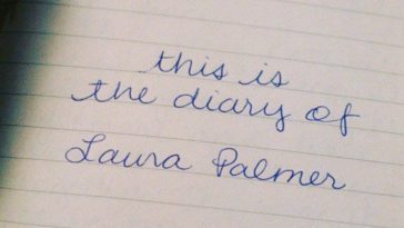 "this is the diary of Laura Palmer" written in cursive on a white piece of paper