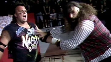 Cactus Jack prepares to whip Jerry Saggs into something hard at Spring Stampede 1994