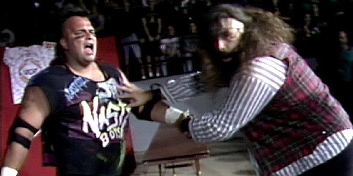 Cactus Jack prepares to whip Jerry Saggs into something hard at Spring Stampede 1994