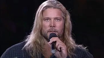 Mike Awesome holds a mic