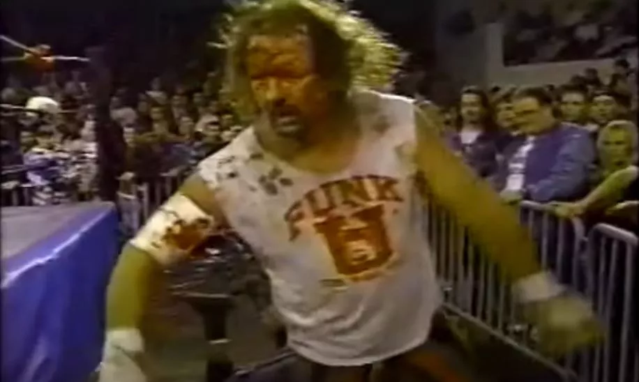 Terry Funk in a Funk U shirt, bloodied