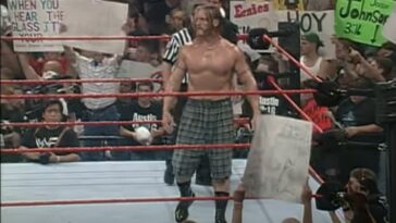 William Regal stands in the ring