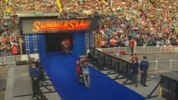 Men on motorcycles under a sign that reads SummerSlam