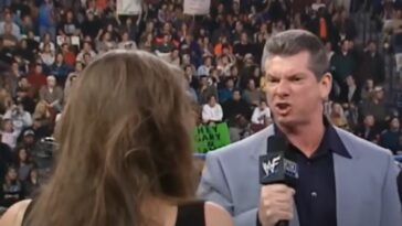 Vince McMahon makes an angry face into a microphone