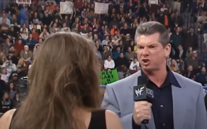 Vince McMahon makes an angry face into a microphone