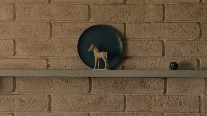 Carrie's fireplace mantel with the white horse and blue plate.