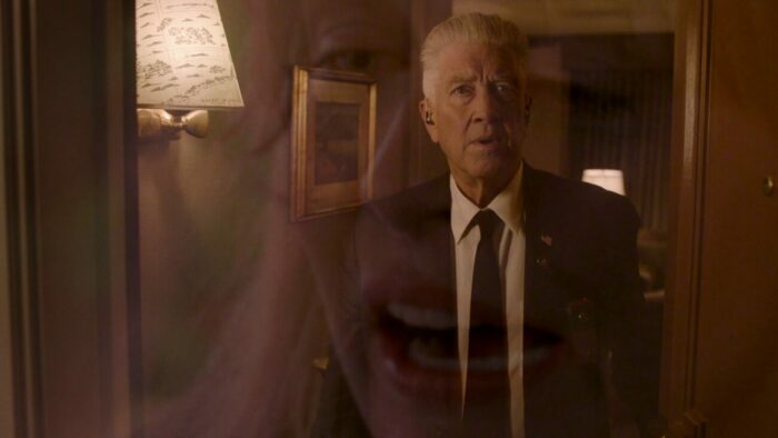 Gordon opens his hotel room door and we see him framed within Laura's head.