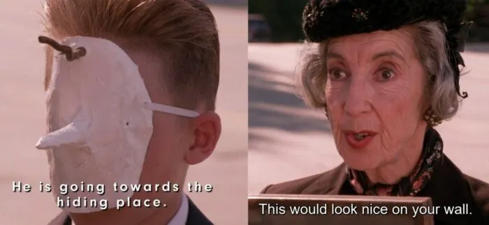 Pierre wearing mask with stick extending from forehead and Mrs. Tremond giving Laura the painting.