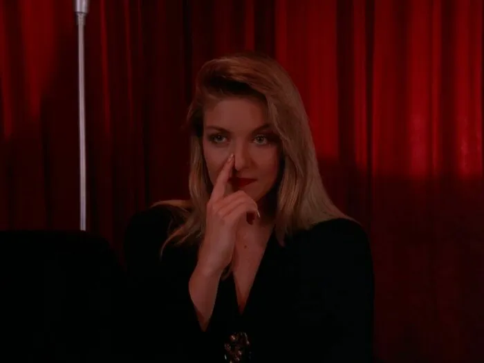 Laura touching her nose in the Red Room.