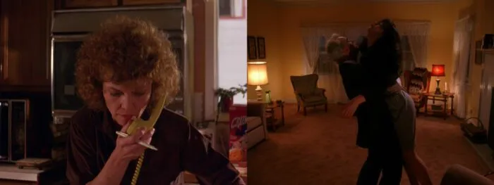 Sarah speaking into yellow phone, next to Leland lifing Maddie inside living room with yellow walls.