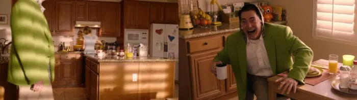 Cooper-Dougie walking into kitchen in big green jacket, and drinking coffee with a tie around his head.