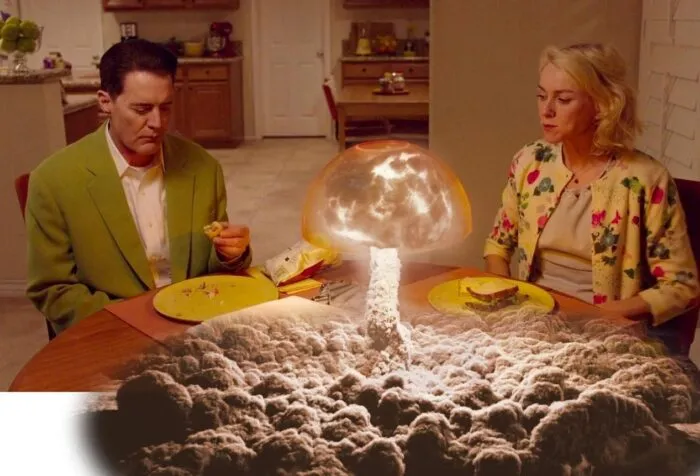Cooper-Dougie and Janey-E eating sandwiches at the dinner table, the lamp between them superimposed with the exploding trinity bomb.