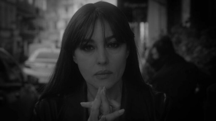 Monica Bellucci looking into camera as she holds her hands in a mudra, Part 14.