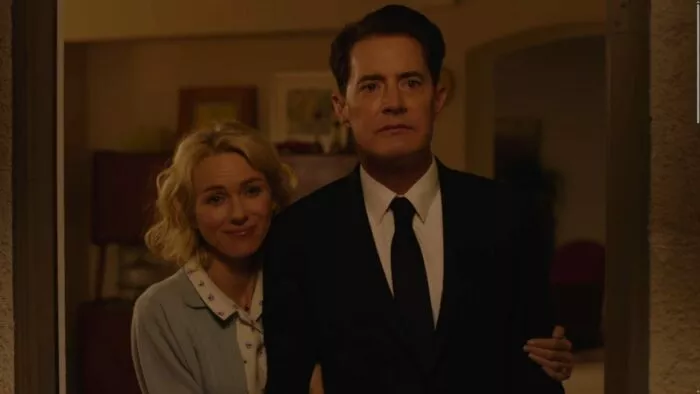 Cooper and Janey-E standing in a doorway