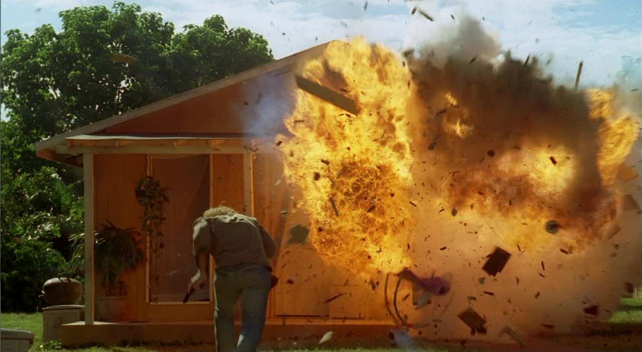 Sawyer runs towards an exploding house in The Shape of Things to Come