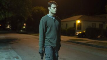 Bill Hader walks with a gun in his hand in the pilot episode of Barry