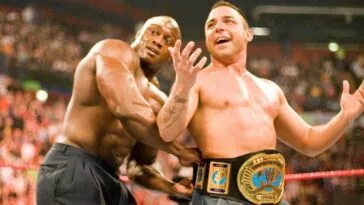 Bobbly Lashley straps the IC belt onto Santino on the Italian's WWE debut match.