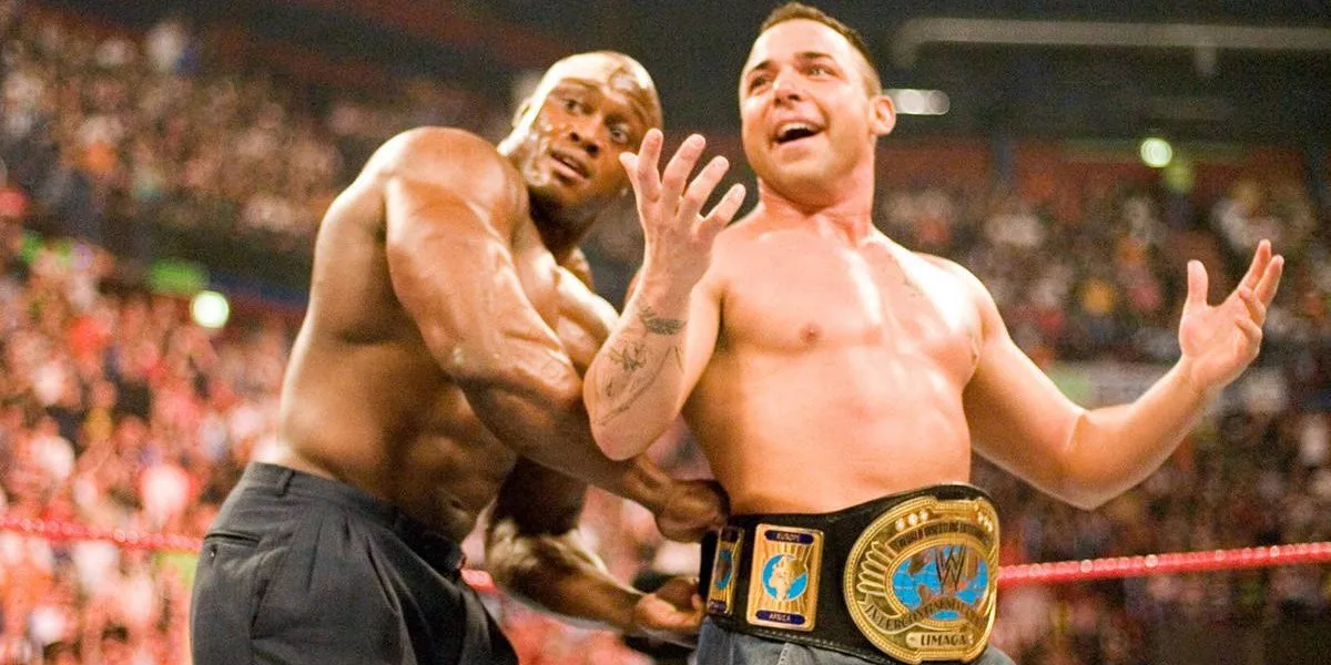 Bobbly Lashley straps the IC belt onto Santino on the Italian's WWE debut match.