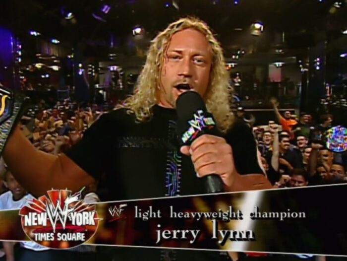Jerry Lynn displays the Light Heavyweight title, a belt he claimed in his WWE debut match.