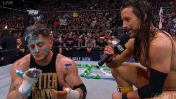Adam Cole consoles a cake-splattered MJF