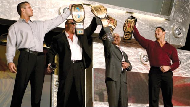 Randy Orton and Evolution display all their title gold.