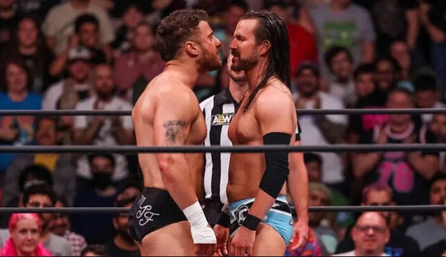 Maxwell Jacob Friedman and Adam Cole squaring up in the ring in their first match