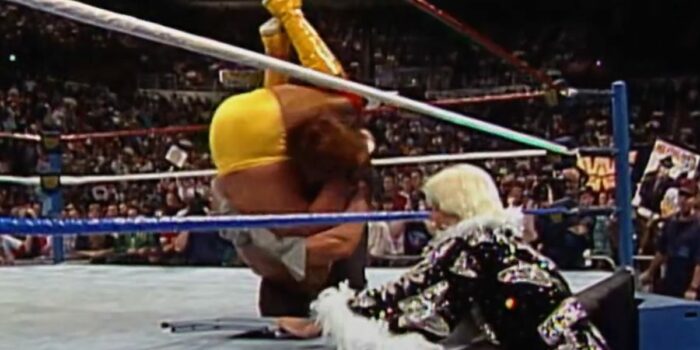 The Undertaker performs a tombstone on Hogan, his head a notable few inches away from the chair held by Ric Flair.