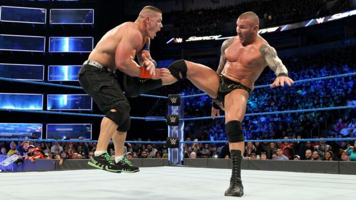 Randy Orton lands a kick on John Cena