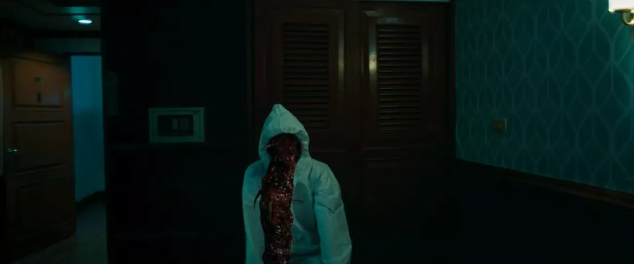 A parasitic monster reaching out from its host