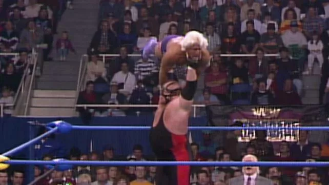 Big Van Vader prepares to press slam Ric Flair