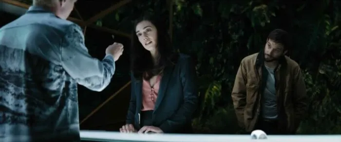 Eron showing Grey and Asha his STEM chip