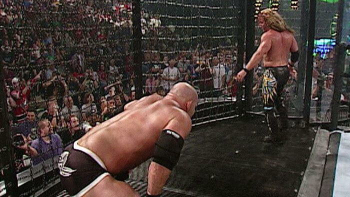 Goldberg stalks Chris Jericho in the Elimination Chamber at SummerSlam 2003.