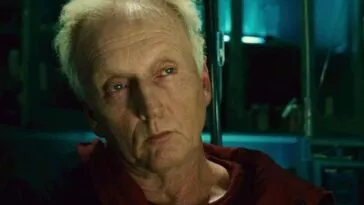 John Kramer (Jigsaw) engaging in a conversation to someone off-screen