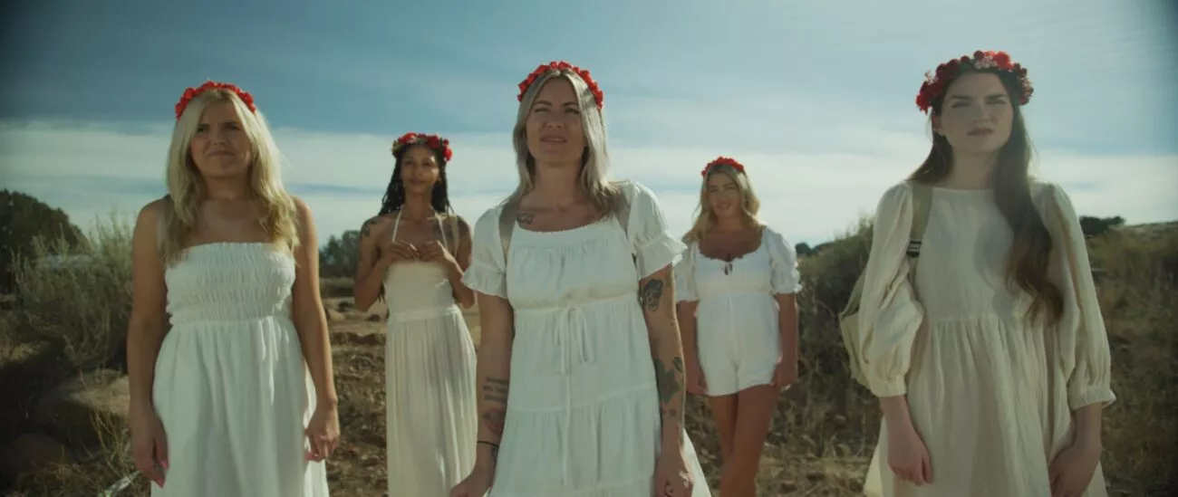 Five women dressed in white