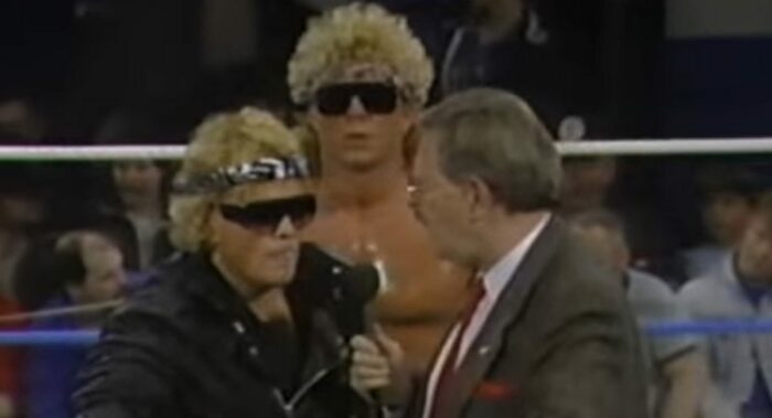With large, frizzy, blonde hair, Brian Pillman and Bruce Hart cut an in-ring promo.