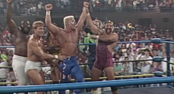 Members Rick Steiner, Paul Orndorff, and The Junkyard Dog are front and centre congratulating Sting after his title victory.