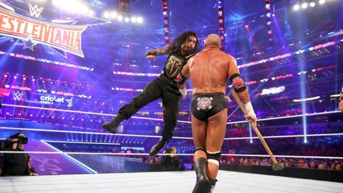 Roman Reigns hits the Superman Punch on Triple H at WrestleMania 32